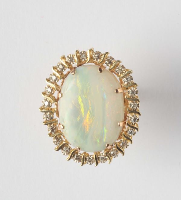 An opal and diamonds cluster ring