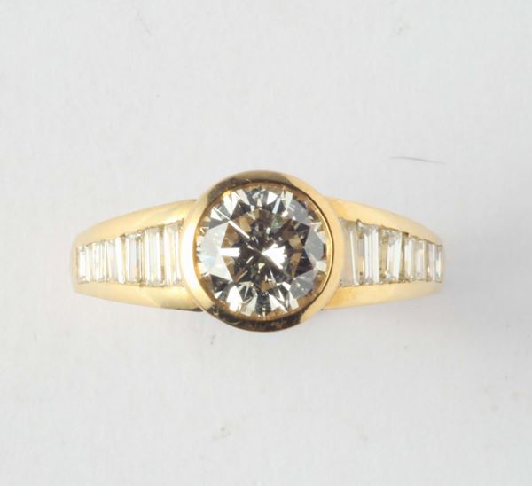 A brilliant-cut diamond weighing ct 1,40 and diamonds ring