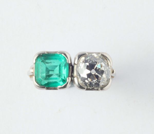 An old-cut diamond, colombian emerald and platinum ring