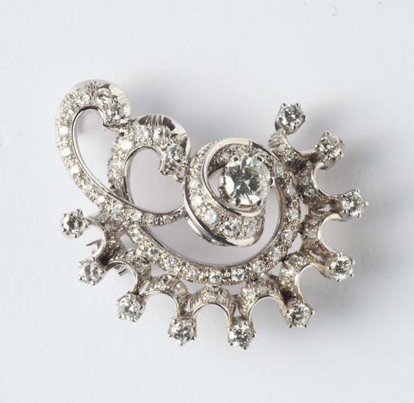 A gold and diamonds brooch