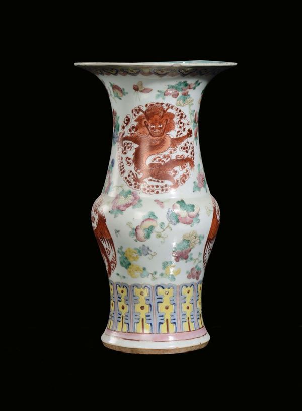 A polychrome porcelain vase with stylized forms and rosettes with dragon, China, Qing Dynasty, 19th century