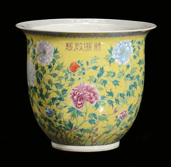 A polychrome porcelain Cachepot with floral decoration on yellow background and ideograms, China, Qing Dynasty 19th century