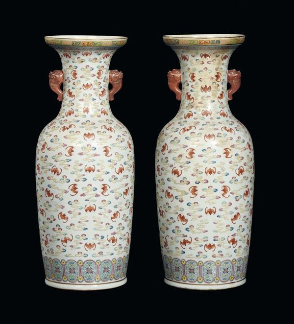 A pair of polychrome porcelain vases with bats, China, Qing Dynasty, 19th century