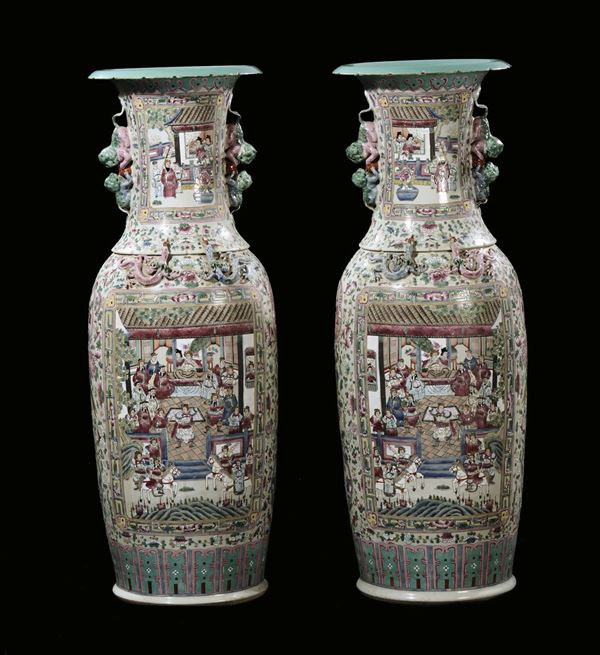 A pair of large polychrome porcelain vases with landscapes and every-day life scenes, China, 20th century