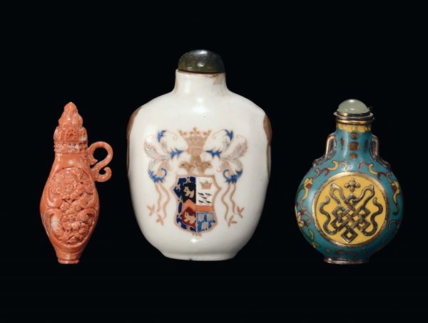Three porcelain, coral and cloisonné snuff bottles, China, Qing Dynasty, 19th century