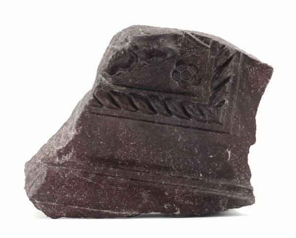 An ancient red porphyry fragment with plaited decoration and moulded frame Roman stone-cutter probably 19th century