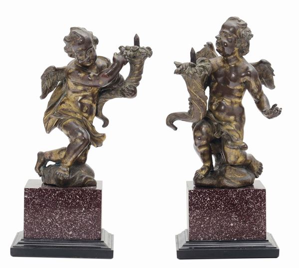 A pair of molten, chiselled and gilt bronze hold-candle angels, Italian art (Rome), 17th century