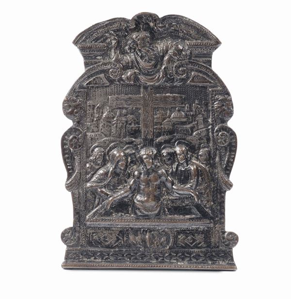 A molten, chiselled, gilt and silvered bronze pax representing the Deposition, Lombard school, 17th century