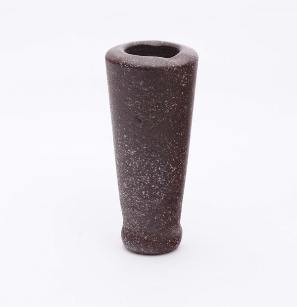 A small porphyry mortar in the shape of a truncated cone with convex frame  on the bottom, Italian stone cutter, probably 17th century