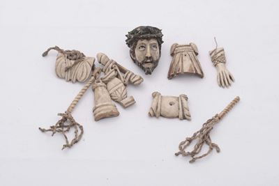 Serie di Otto Intagli in Osso Raffiguranti Simboli della Passione e Volto di Cristo Coronato di S...