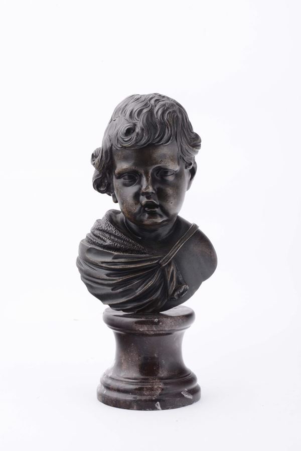 A molten and chiselled bronze child bust on a polished marble base, art of the 18th -19th century