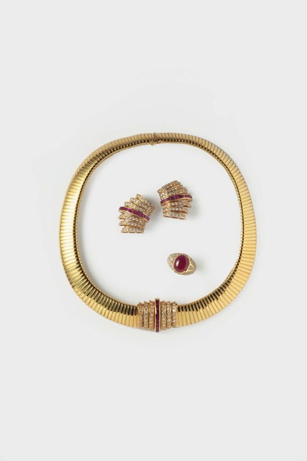 A ruby, diamond and gold ring, necklace and earrings