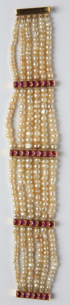 A six-row of natural pearls and ruby bracelet