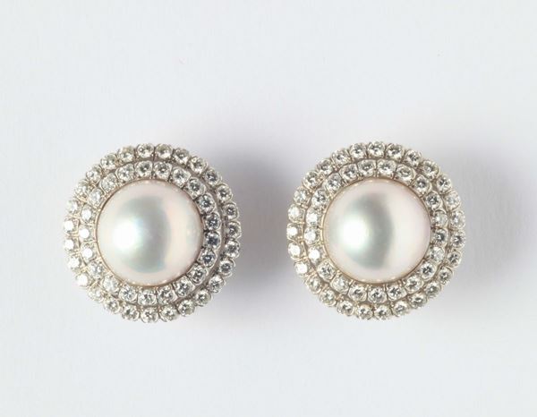 A pair of mabe pearls and diamonds earrings