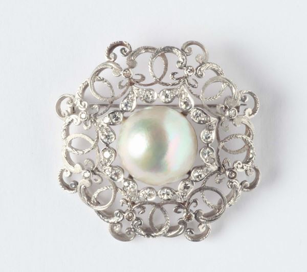 A mabe pearls and diamond brooch