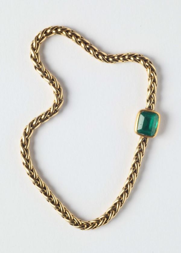 An emerald and gold bracelet. Signed Ostorero, Torino