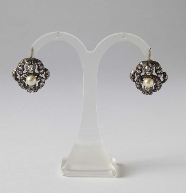 A pair of diamond, pearl and silver earrings