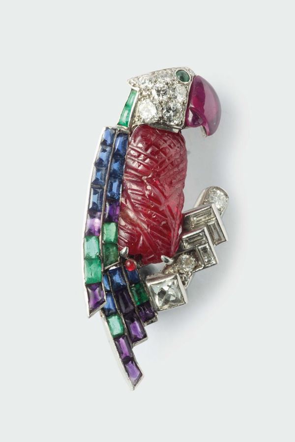 A ruby, sapphire, emerald and diamond brooch. Signed Cartier, London 1978