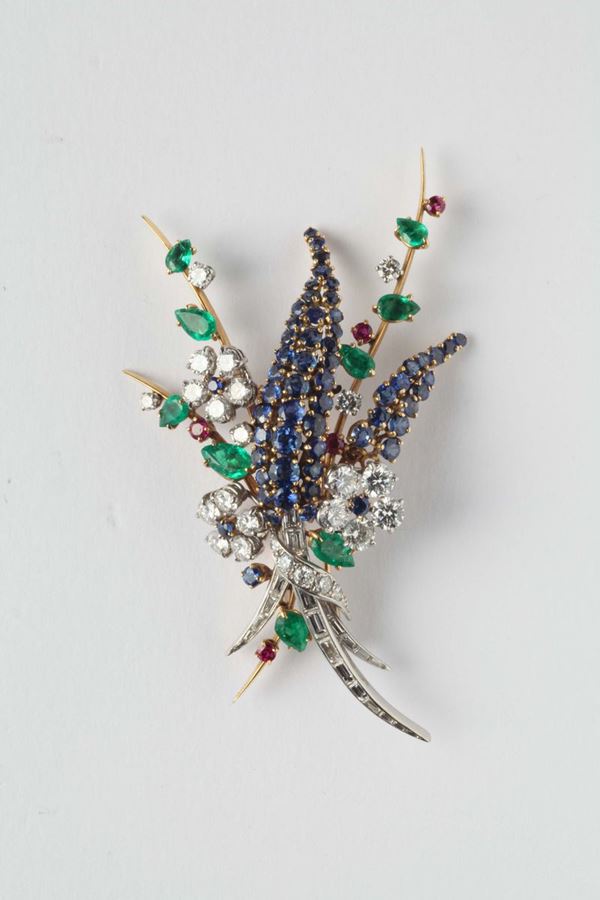 A diamond, emerald and sapphire brooch
