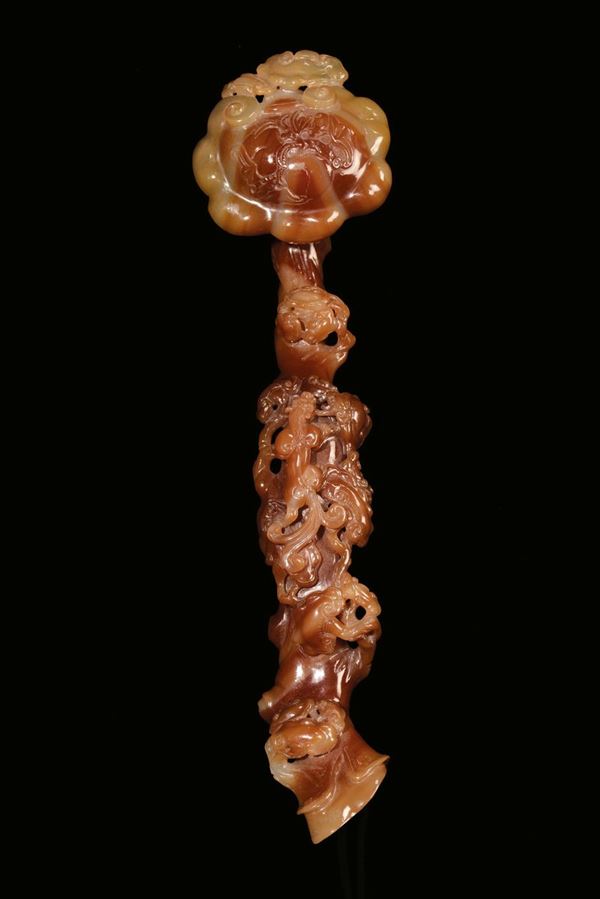A carved agate Ruji with floral motives, China, Republic, 20th century