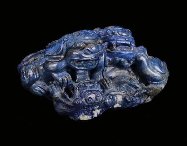 A carved lapis lazuli “Pho dog” group, China, Qing Dynasty, Jiaqing Period (1796-1820)