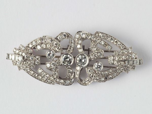A platinum and diamond double-clip brooch