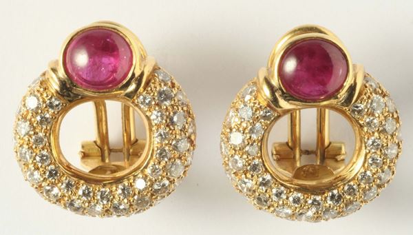 A pair of ruby, diamond and gold earrings