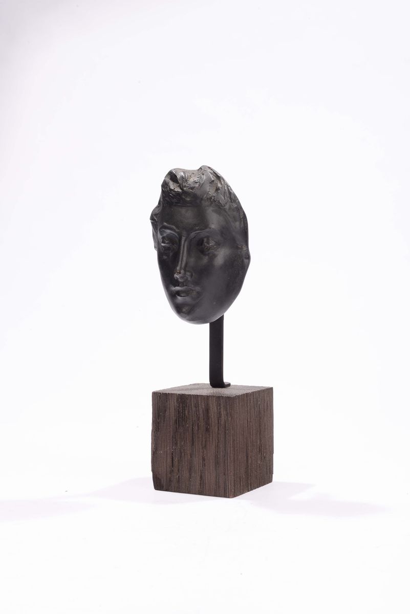 Scultura con Viso in Metallo.