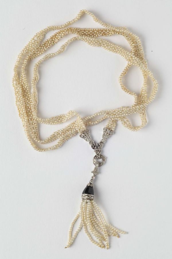 A seed pearls, diamonds and onix necklace
