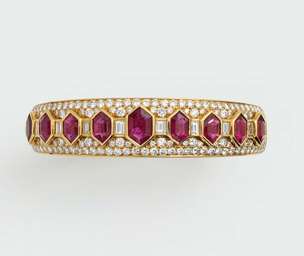 A ruby and diamond bracelet. Signed Bulgari