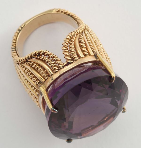 An amethyst and gold ring