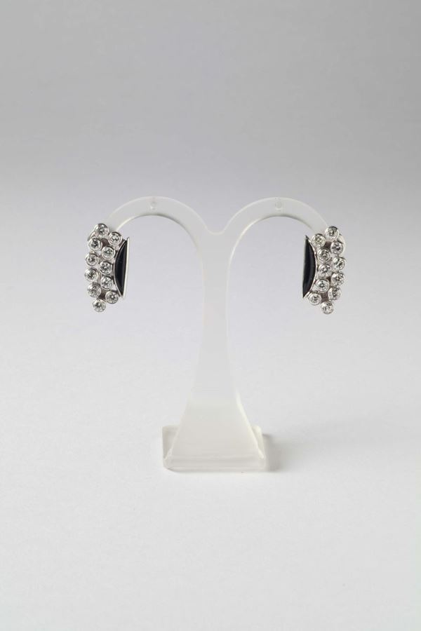 A pair of a diamond and enamel earrings