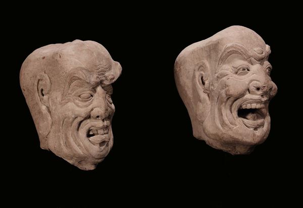 A pair of stone heads, China, probably Ming Dynasty