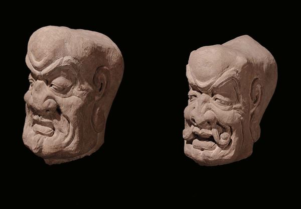 A pair of stone heads, China, probably Ming Dynasty