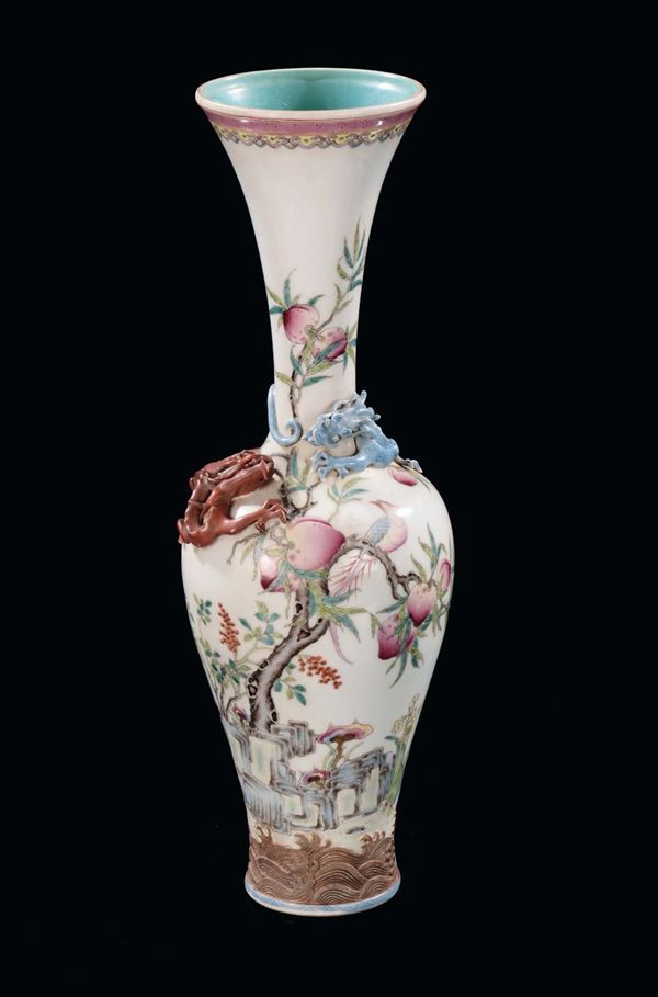 A porcelain long neck vase with relief dragon, China, Repubblica, 20th century