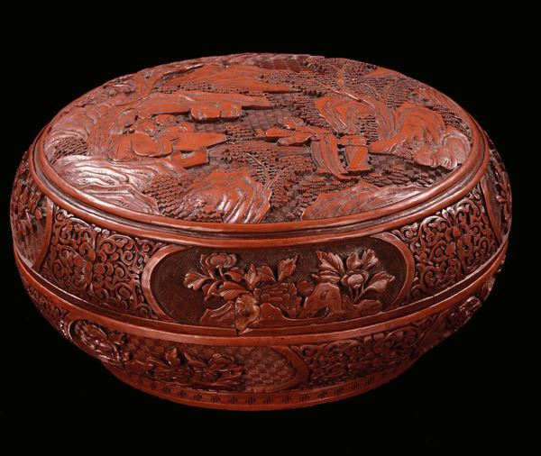 A circular and carved red lacquer box with floral decoration, China, Qing Dynasty, 19th century