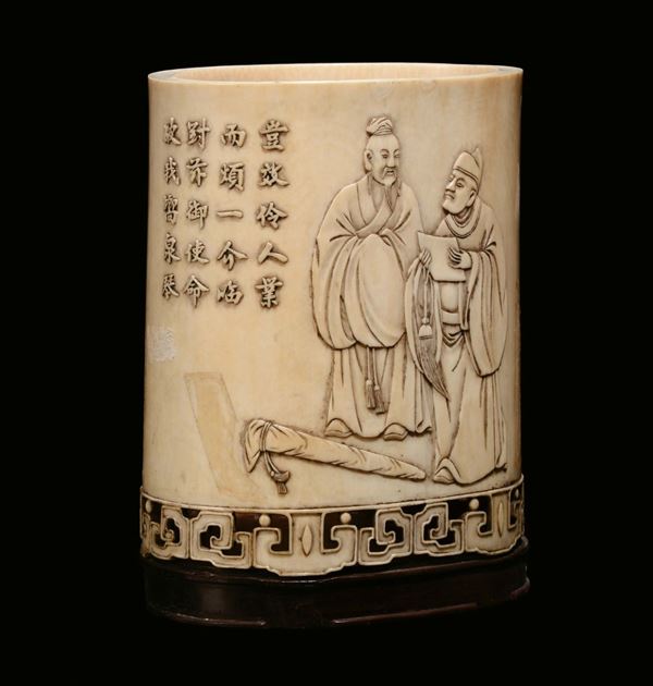 A carved bas-relief ivory brush-holder with oriental figures, China, Qing Dynasty, 19th century