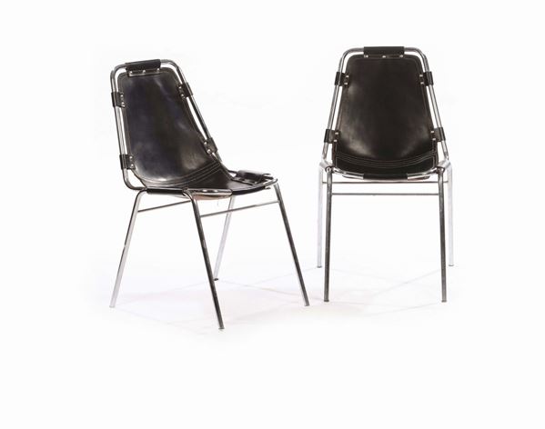 Charlotte Perriand (attribuzione)Coppia di sedie in tubolare cromato con seduta e schienale in cuoio. Prod. Francia, 1970 ca.