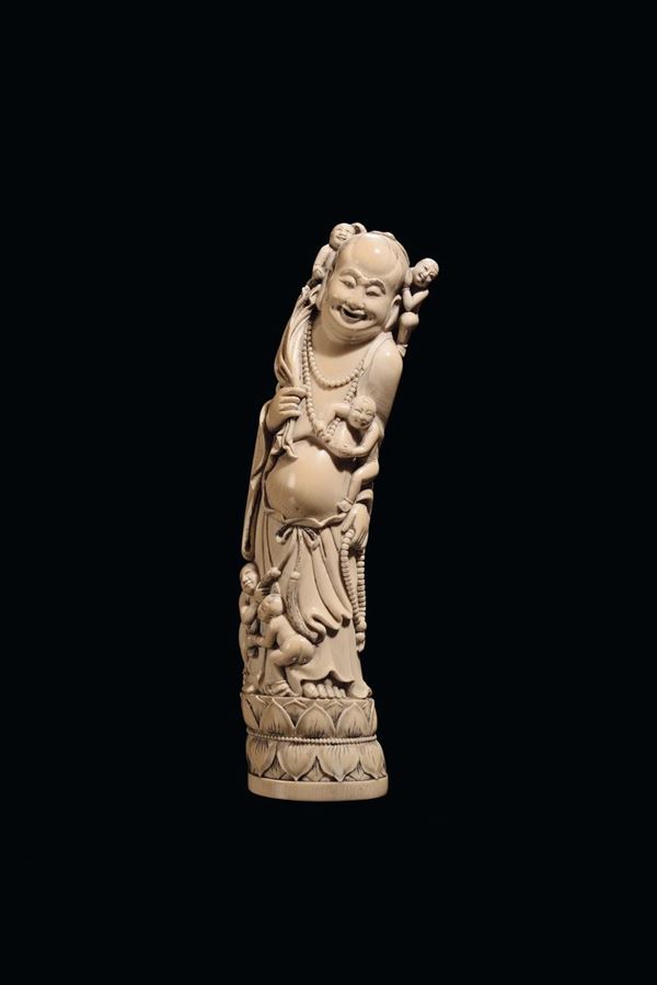 A carved ivory figure of Budai with boys, China, Qing Dynasty, 19th century
