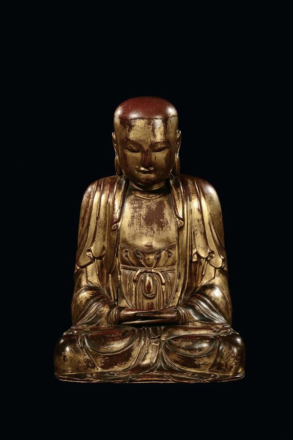 A carved wood Buddha, China, Ming Dynasty, 17th century