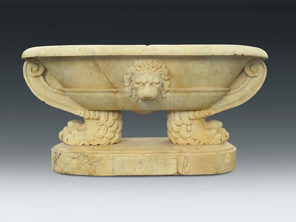 A white marble oval basin carved with feral decorations, Italian art 19th or 20th century