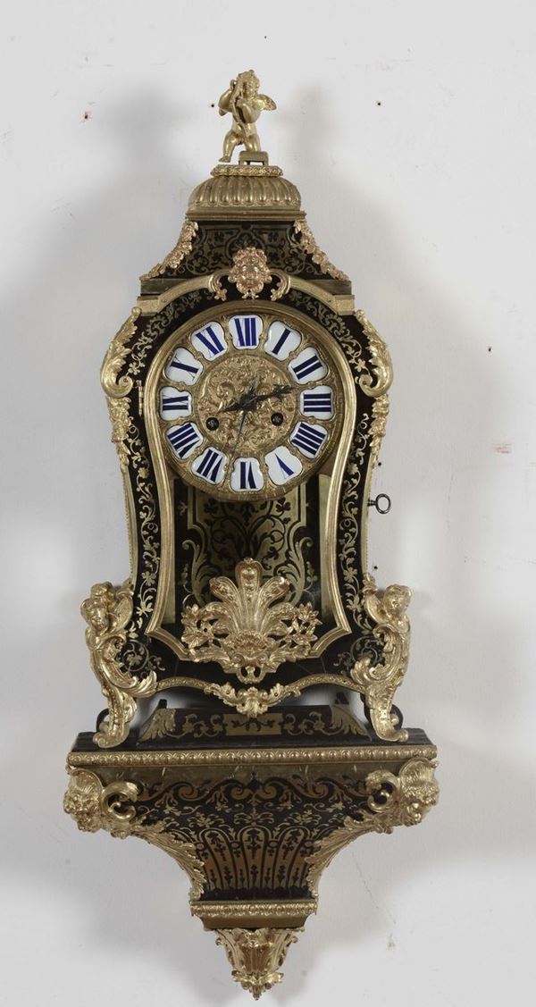 Piccolo orologio Boulle in legno lastronato, XIX secolo