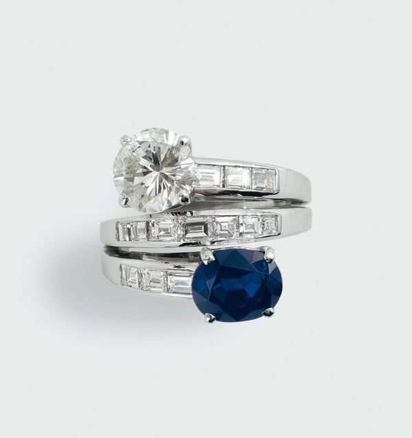 A diamond and sapphire cross-over ring