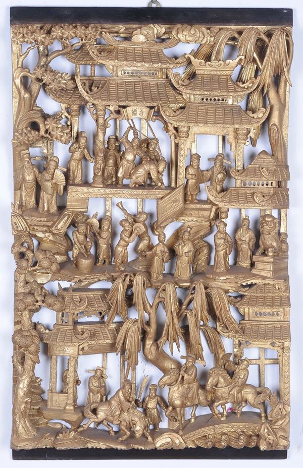 A carved and gilded wood panel worked with scenes of court life, China, Qing Dynasty, 19th century