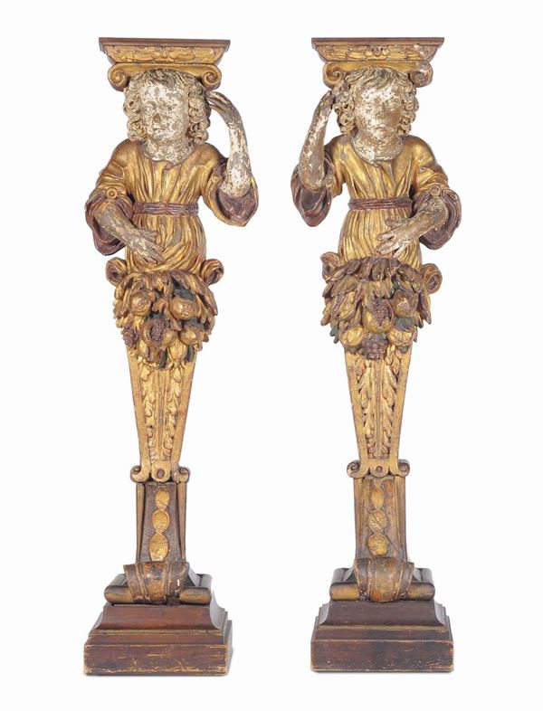 Coppia di mensole da terra in legno intagliato e dorato, XIX secolo