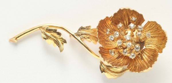 A diamond and gold open-and-shut flower brooch