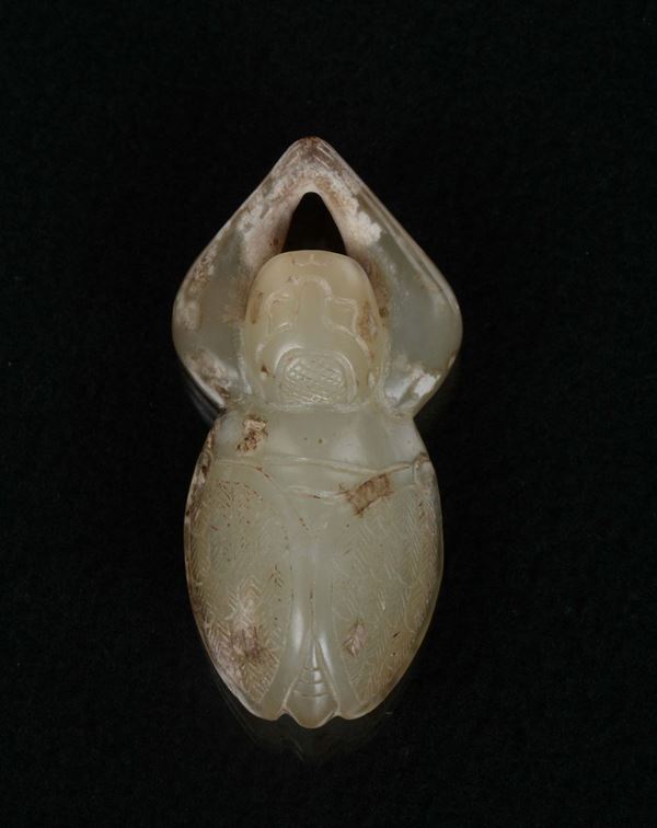 A carved white jade with russet cicada, China, Qing Dynasty, 19th century