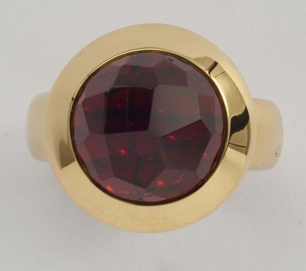 A garnet and gold ring by Pomellato