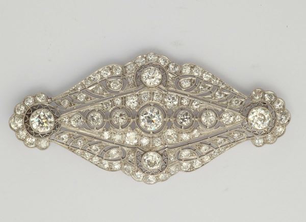 A diamond and gold brooch