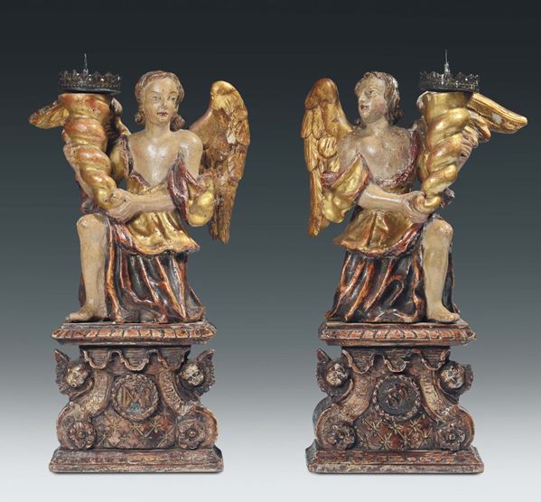 A pair of carved, painted and gilt wood genuflected angels, Italian art, 17th century